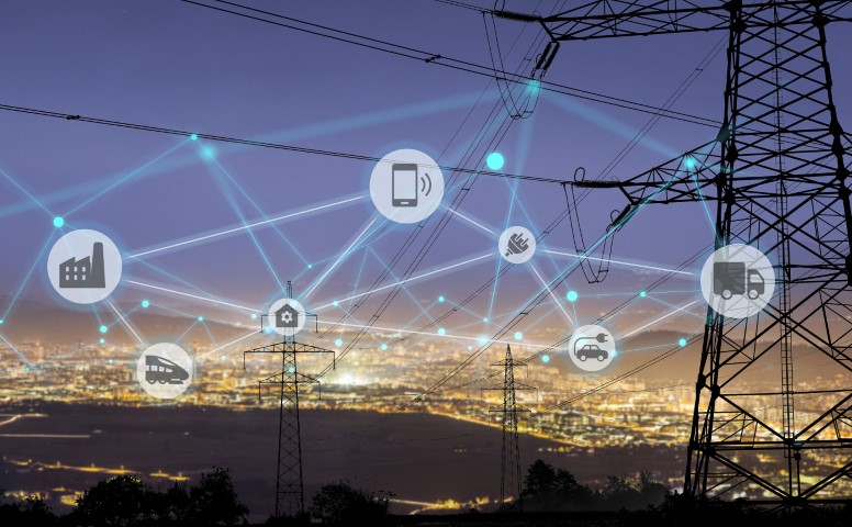 Un paisaje de servicios eléctricos por la noche con burbujas de IoT.